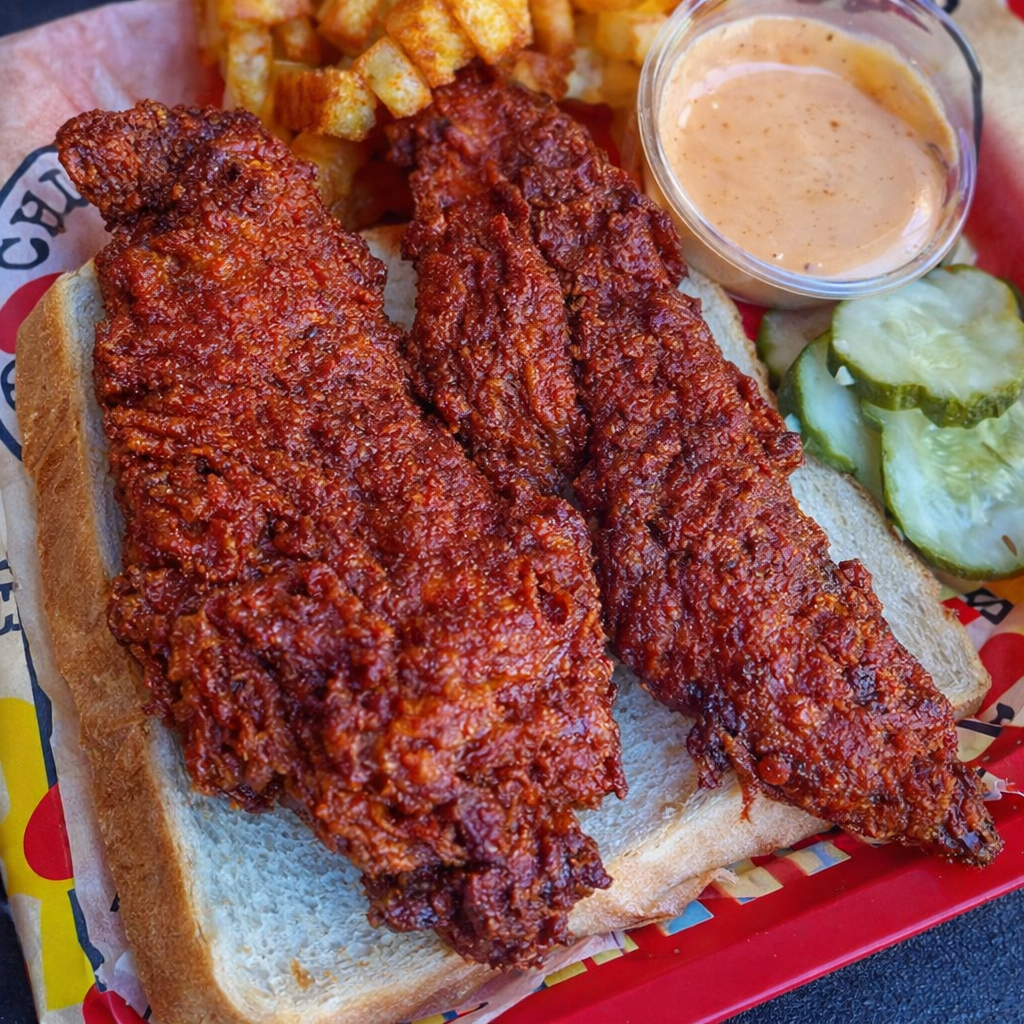 Two spicy fried chicken tenders served on white bread 