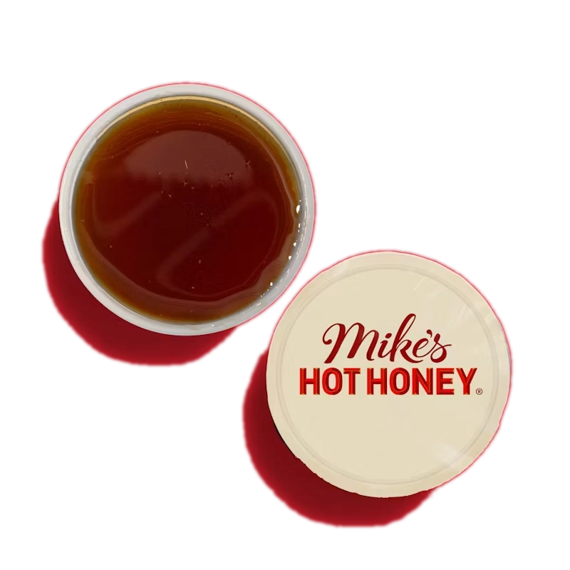 Side of Mike's Hot Honey Dipper with sweet and spicy honey flavor