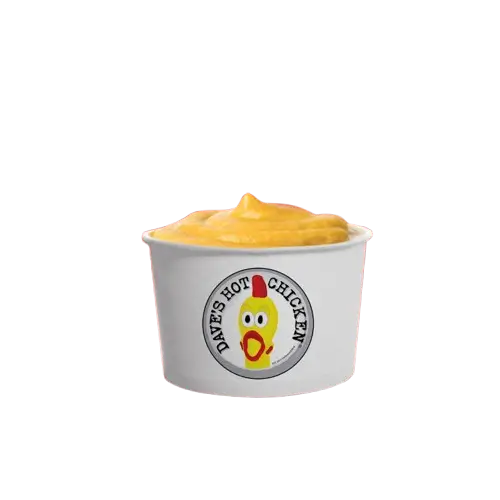 Side of Cheese Sauce served with Dave's Hot Chicken fries, tenders and sliders